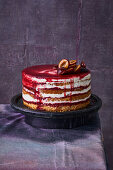 Hazelnut sponge cake with cinnamon mousse and plums