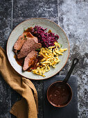 Malt beer sauerbraten with red cabbage and spaetzle