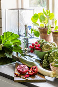 Fresh vegetables and fruit on a kitchen counter