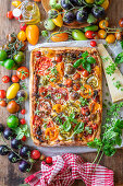 Yeast bread from the sheet with tomatoes, cheese, and basil