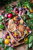Grilled pork chops roasted with plums