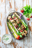 Asparagus with grilled chicken stawberry skewers