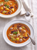 Cabbage soup with wine sausage balls