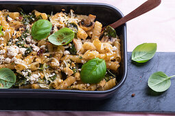 Vegan noodle casserole with spinach, mushrooms and tofu topping