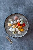 Assorted goat cheese balls with herb and spice coating