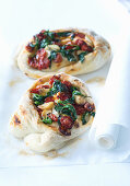 baked pizza pockets with oven-dried cherry tomatoes, garlic, and basil