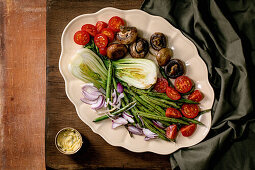Grilled mushrooms, cherry tomatoes, green beans and bok choy salad plate