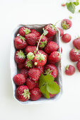 Fresh strawberries in a paper basket