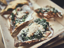 Rockefeller oysters (gratinated oysters with spinach, USA), ready to cook