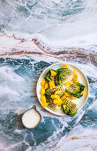 Mango and black pepper with charred lettuce and horseradish dressing