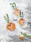 Gin and tonic with blood orange and thyme