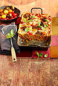 Meatball lasagne with cherry tomatoes