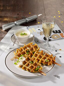 Courgette and cheese waffles on sticks for New Year's Eve