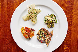 A selection of antipasti, char-grilled fennel, aubergine, courgette and roasted peppers