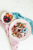 Assorted high protein donuts with berries