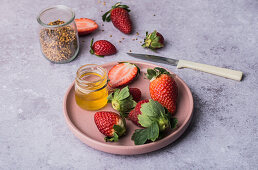 Fresh strawberries with honey and granola