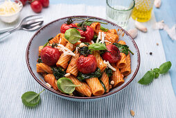 Tortiglioni with spinach, grilled vine tomatoes and pine nuts