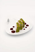 Pistachio cake with berry sauce