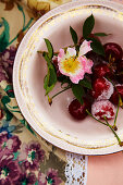 Sugared cherries with blossoms in a bowl