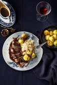 Roast goose breast with sauerkraut and polenta-and-Parmesan dumplings