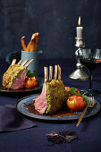 Rack of lamb with a herb crust and braised tomatoes