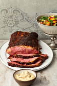 Roast beef in tomato-balsamic rub with sweet potato-harissa salad