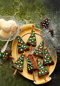 Chocolate fir tree biscuits on sticks