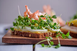 Sandwich with boiled egg, prawns and cress