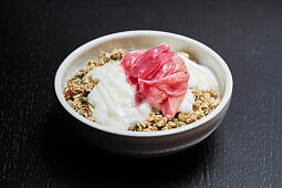 Rhubarb and yoghurt topped granola bowl