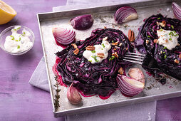 Oven-baked red cabbage with herb soy curd and pecans