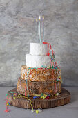 Cheese Wedding Cake - wheels of Cheese arranged as a multi-tiered wedding cake, with candles