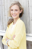 Young blonde woman in yellow cardigan