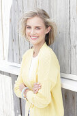 Young blonde woman in yellow cardigan