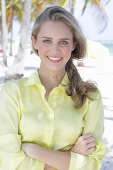 Boy, blonde woman in yellow blouse