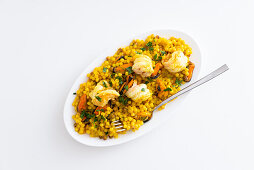 Fregola pasta with turmeric, mussels, and scampi