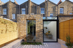 View from the inner courtyard garden to the extension of the English workers' house