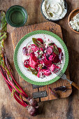 Beetroot ravioli with cream cheese filling, pickled beets and feta cheese