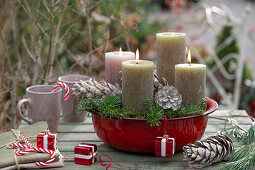 DIY Advent wreath in red enamel bowl