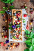 Dissicated coconut, wholewheat flour, coconut oil base pie with cream and berries