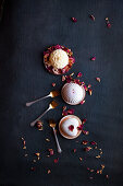 Festive Single servings of cake with dried rose petals