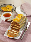 Layered honey cake with orange butter cream