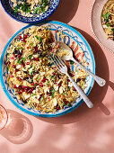 Rice, with pomegranate, toasted almonds and cinnamon