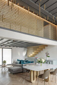 Art Deco dining table in an open-plan living room loft