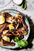 Grilled chicken thighs with lemon slices