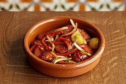 Spanish tapas. Chorizo, tomatoes, peppers and red onion