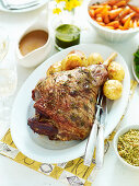 Roasted lamb with spring herb crumbs and side dishes
