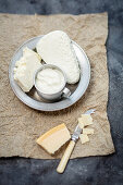 Various dairy products - feta, cottage cheese, Parmigiano, yogurt