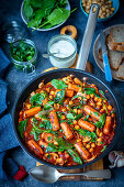 Sausages with chickpeas and spinach