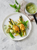 Crispy asparagus with wild garlic crepes and potatoes in wild garlic sauce