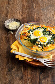 Macaroni and fried egg casserole with spinach